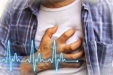 Person holding chest possible heart attack image